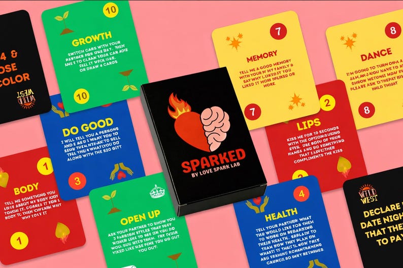 SPARKED card game with colored deck fanned out